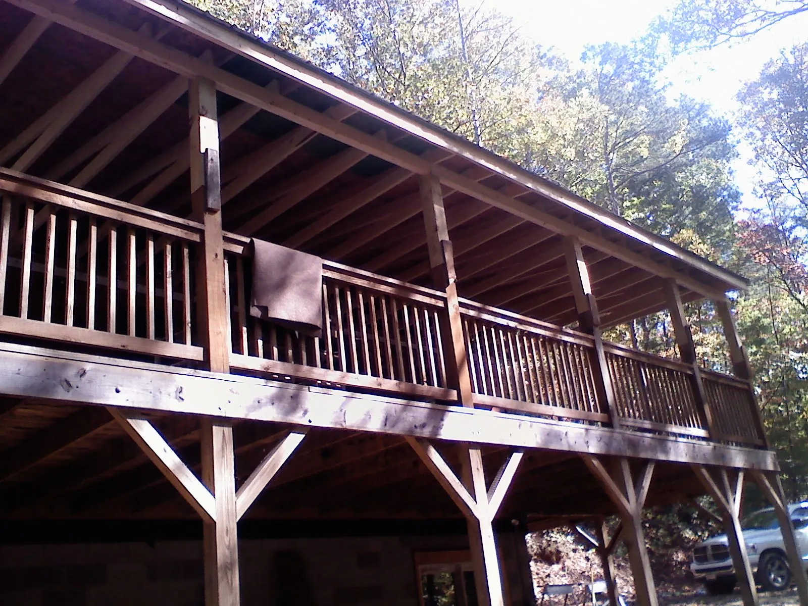 Timber framing under a new elevated porch and deck — Roof Leak Repair in Belmont by Roofing Brothers